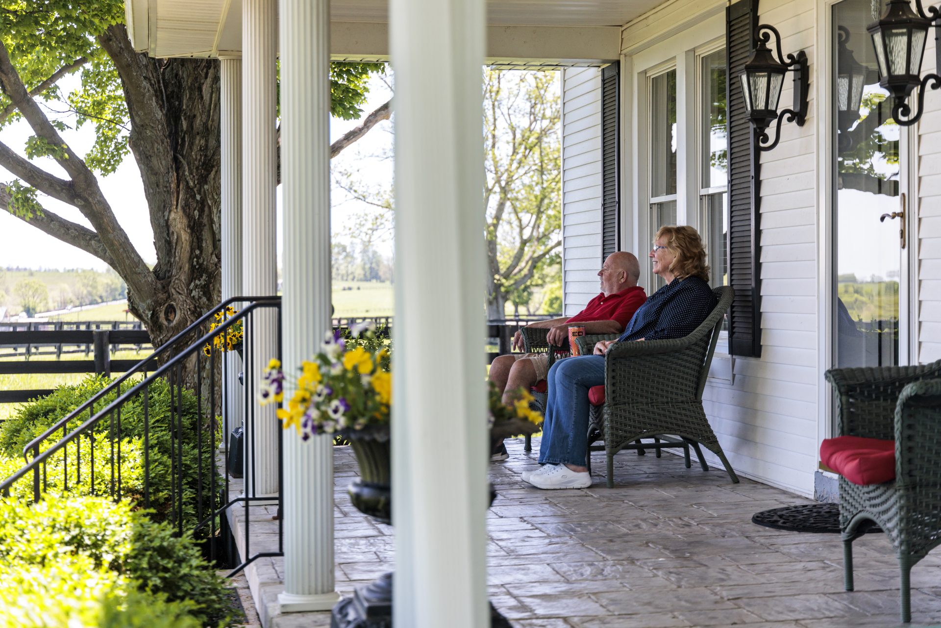 people relaxing on front porch